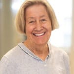 Elderly woman with short blonde hair