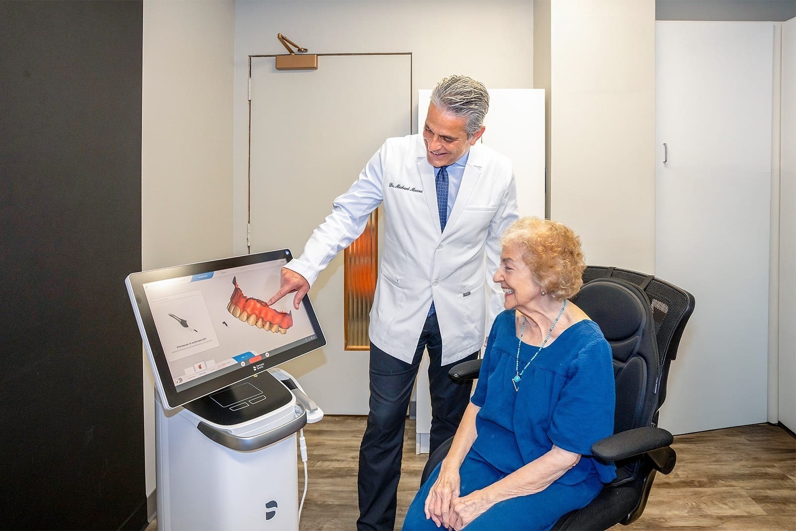 Doctor consulting with elderly patient.