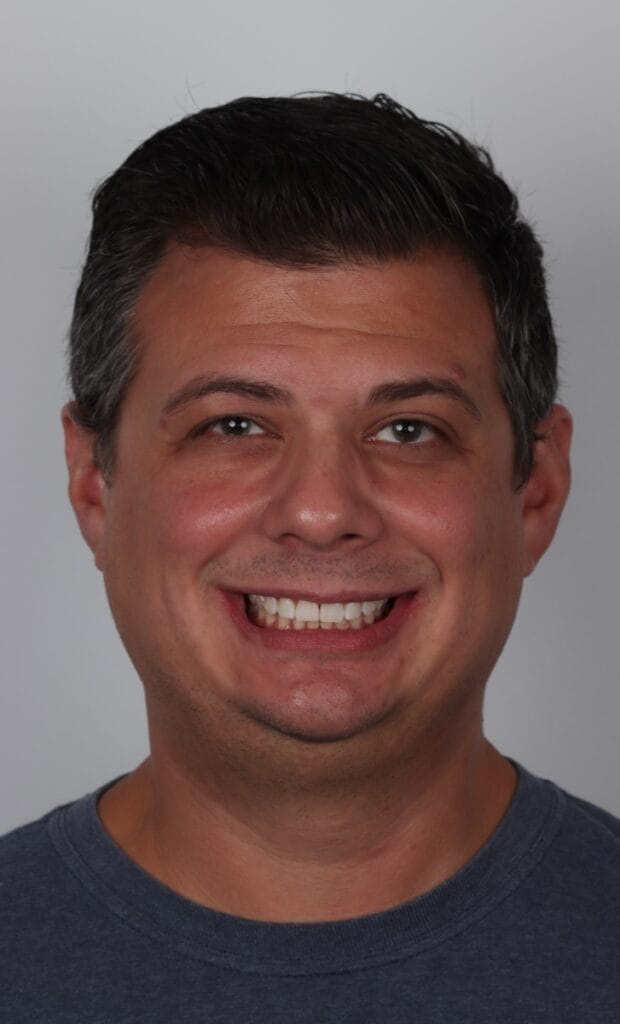 Person with dark hair, neutral expression.